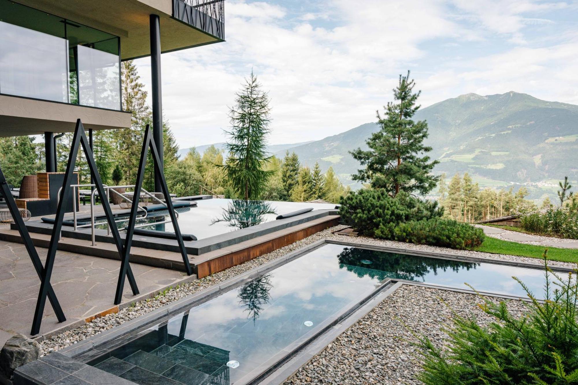 My Arbor - Dolomites Otel Bressanone Dış mekan fotoğraf A private swimming pool in the Alps